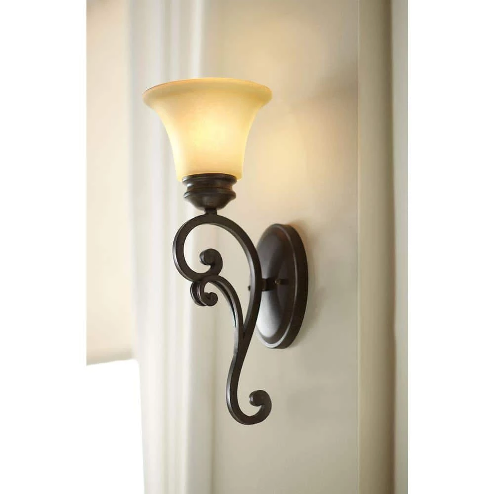 7 in. Mendocino 1-Light Forged Sienna Mediterranean Wall Mount Sconce Light with Amber Glaze Glass Shade by Designers Fountain 4 7 in. Mendocino 1-Light Forged Sienna Mediterranean Wall Mount Sconce Light with Amber Glaze Glass Shade by Designers Fountain - Image 2
