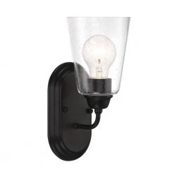 5 in. Zane 1-Light Matte Black Industrial Wall Mount Sconce Light with Clear Seedy Glass Shade by Designers Fountain