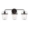24 in. Jaxon 3-Light Oil Rubbed Bronze Industrial Bathroom Vanity Light with Clear Glass Shade by Designers Fountain -Designers Fountain Shop oil rubbed bronze designers fountain vanity lighting 90603 orb 64 1000